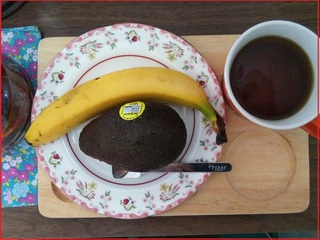 my breakfast of avocado, banana and brewed coffee.jpg