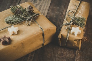 photo-of-two-brown-wrapped-gifts-on-wooden-table-1693650.jpg