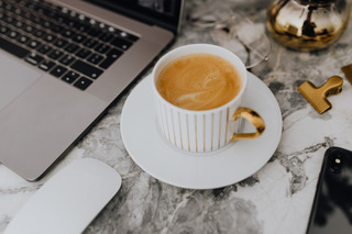 foodiesfeed.com_coffee-in-a-white-cup-on-a-marble-desk.jpg