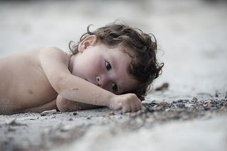 kid doodling on sand.jpg