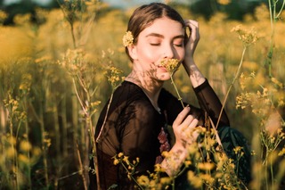 photo-of-woman-smelling-yellow-flower-2466669.jpg