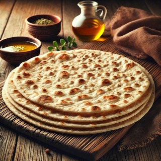 DALLEE 2024-09-20 19.42.32 - A traditional Armenian flatbread called Lavash, displayed on a rustic wooden board. The thin, soft bread is slightly charred, with a golden-brown colo.jpg