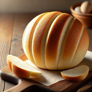 DALLEE 2024-10-14 19.34.35 - A freshly baked loaf of Softball Bread, with a smooth, round, golden-brown crust resembling a softball. The bread is soft and fluffy inside, with a fe.jpg