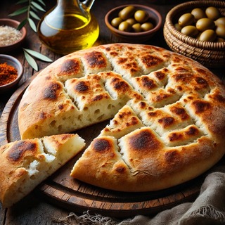 DALLEE 2024-10-15 18.06.21 - A traditional Moroccan Khobz, a round flatbread with a golden-brown crust and a soft, airy interior. The bread is displayed on a rustic wooden board, .jpg