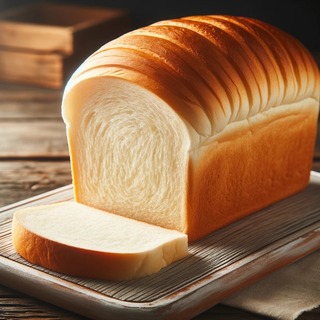 DALLEE 2024-10-21 19.47.39 - A loaf of freshly baked white bread with a soft, golden-brown crust and a light, fluffy interior. The bread is neatly sliced, showing its airy, tender.jpg