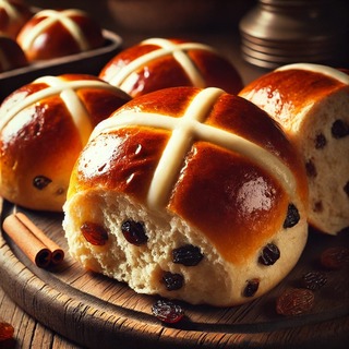 DALLEE 2024-11-04 19.59.46 - A freshly baked batch of hot cross buns, with a golden, shiny crust and a classic white cross on top. The buns are soft and fluffy, filled with raisin.jpg