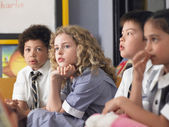 depositphotos_33832569-Multi-ethnic-children-at-classroom.jpg