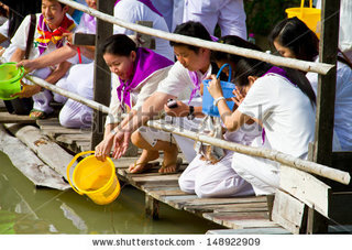 stock-photo-ubonratchathani-thailand-july-unidentified-thai-buddhists-making-good-merit-by-releasing-148922909.jpg