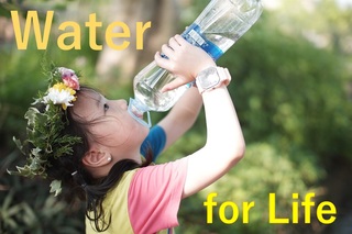 A girl drinking water.jpg